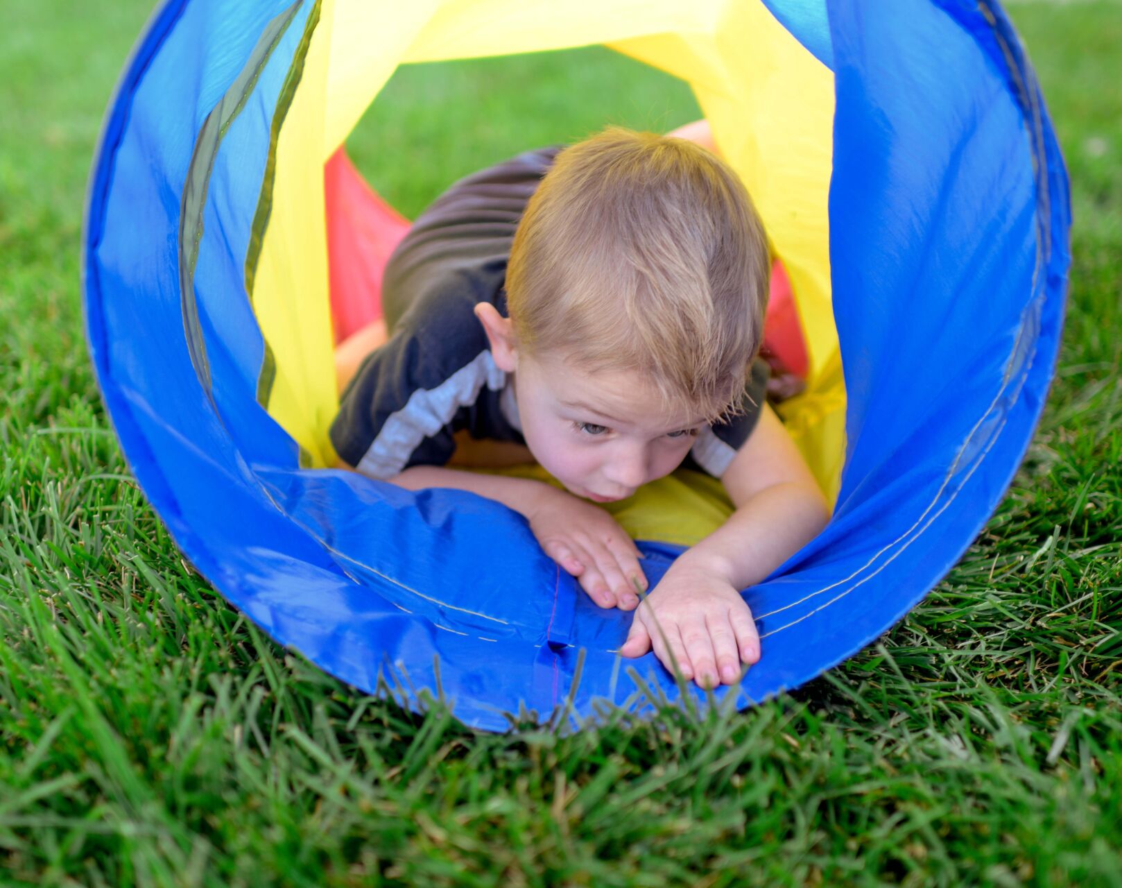 Fletcher Anderson, 3, demonstrates the low crawl his parents taught him to do when he sees fire on Saturday